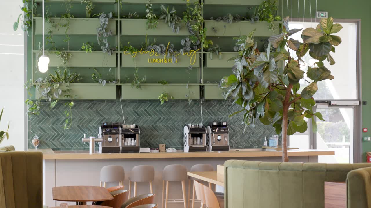Slow panning shot of a floral designed coffee station within an office