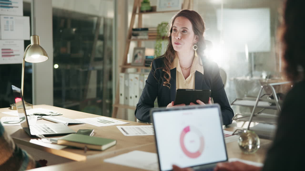 Businesswoman shaking hands with a colleague in a modern office