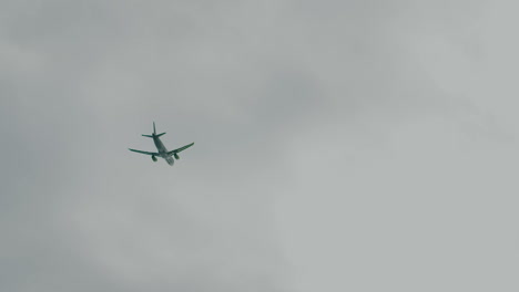 flying airliner agains beautiful cloudy sky