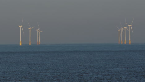 shot of 8 offshore wind turbines at scroby sands wind farm