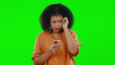 Sad,-phone-and-crying-with-woman-on-green-screen