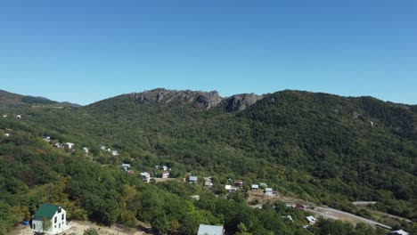 4K-Drone-Shot-Reveals-Enchanting-Traditional-Georgian-Village-Surrounded-by-Lush-Green-Forest-in-Kvemo-Kartli-Region