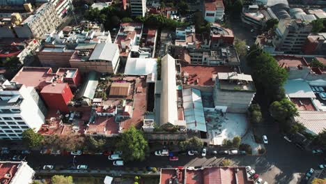 mexico city aerial pedestal shot of the buildings and the road inside the city - mexico cityscape