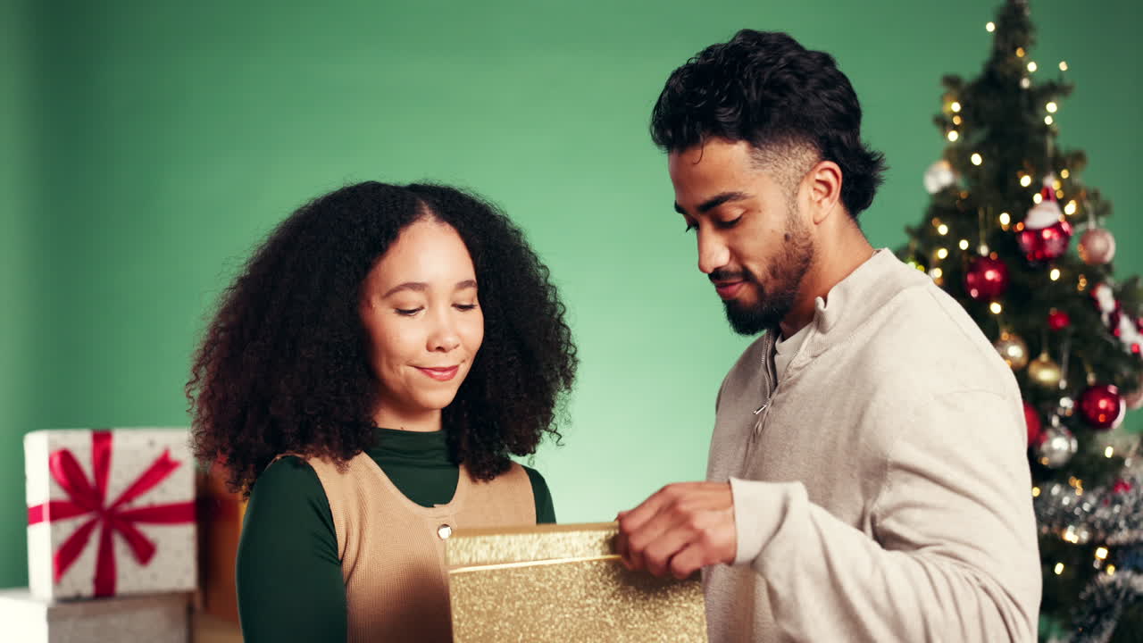 Couple celebrating Christmas with gifts