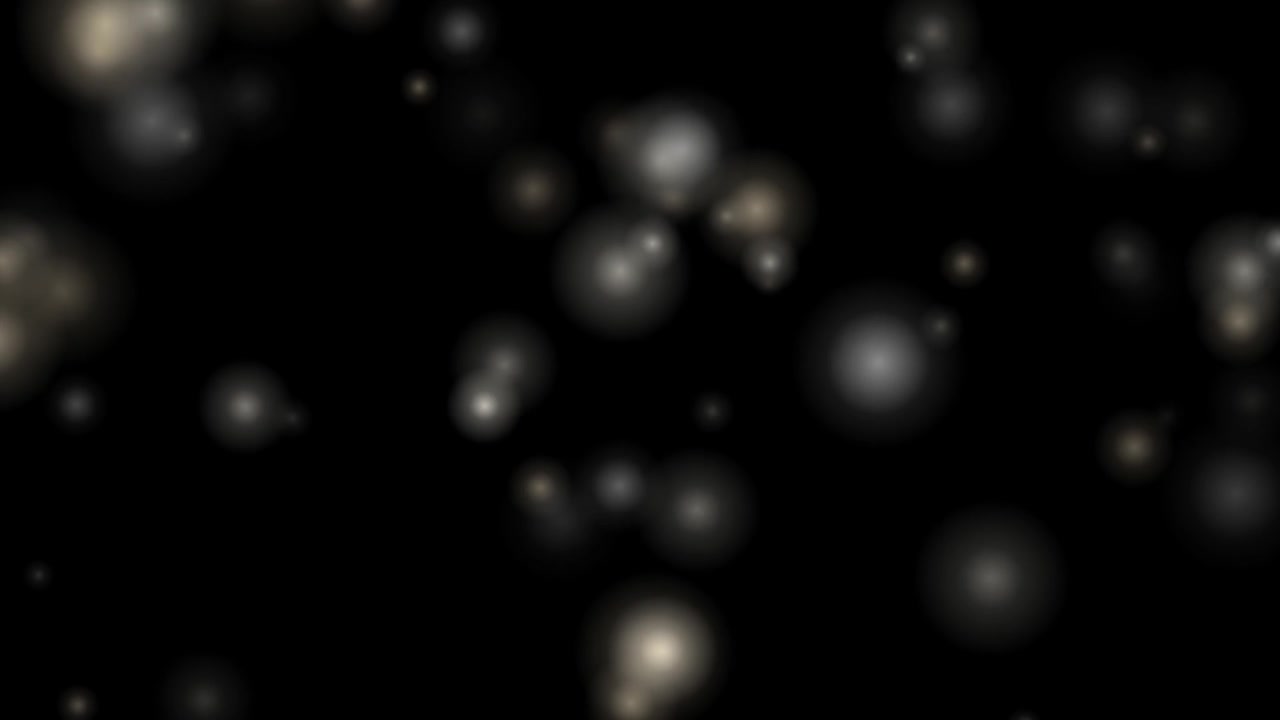 Floating Soft White Bokeh Particles on Black Background