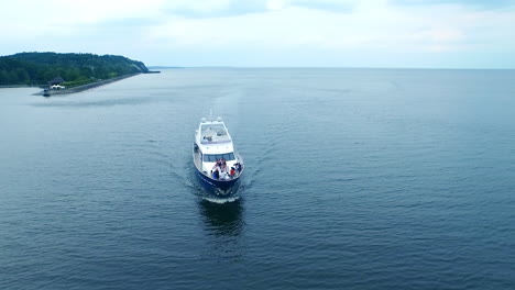 Luxury-yacht-sailing-city-river.-Aerial-view-of-private-party-on-white-boat