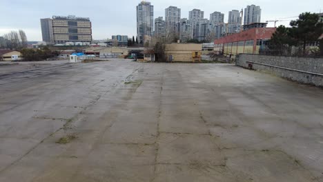 empty industrial land with modern cityscape background