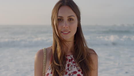 portrait of beautiful young caucasian woman enjoying warm sunny day on beach looking calm pretty brunette female seaside background real people series