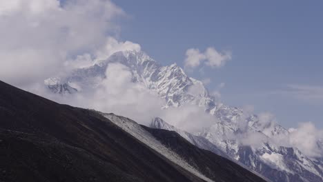 time lapse shot of moving clouds around snowy mount everest in nepal