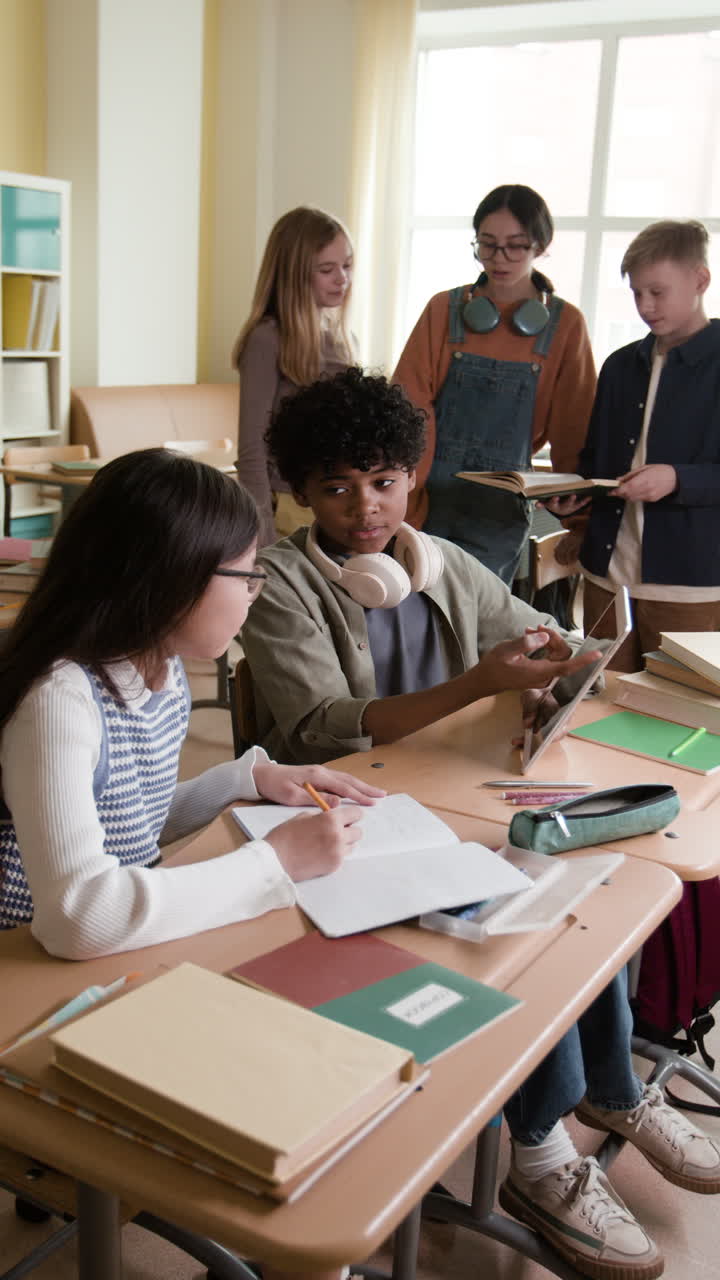 Students collaborating and studying together in a classroom