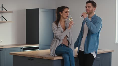 couple making toast for  house ownership with a glass of champagne.