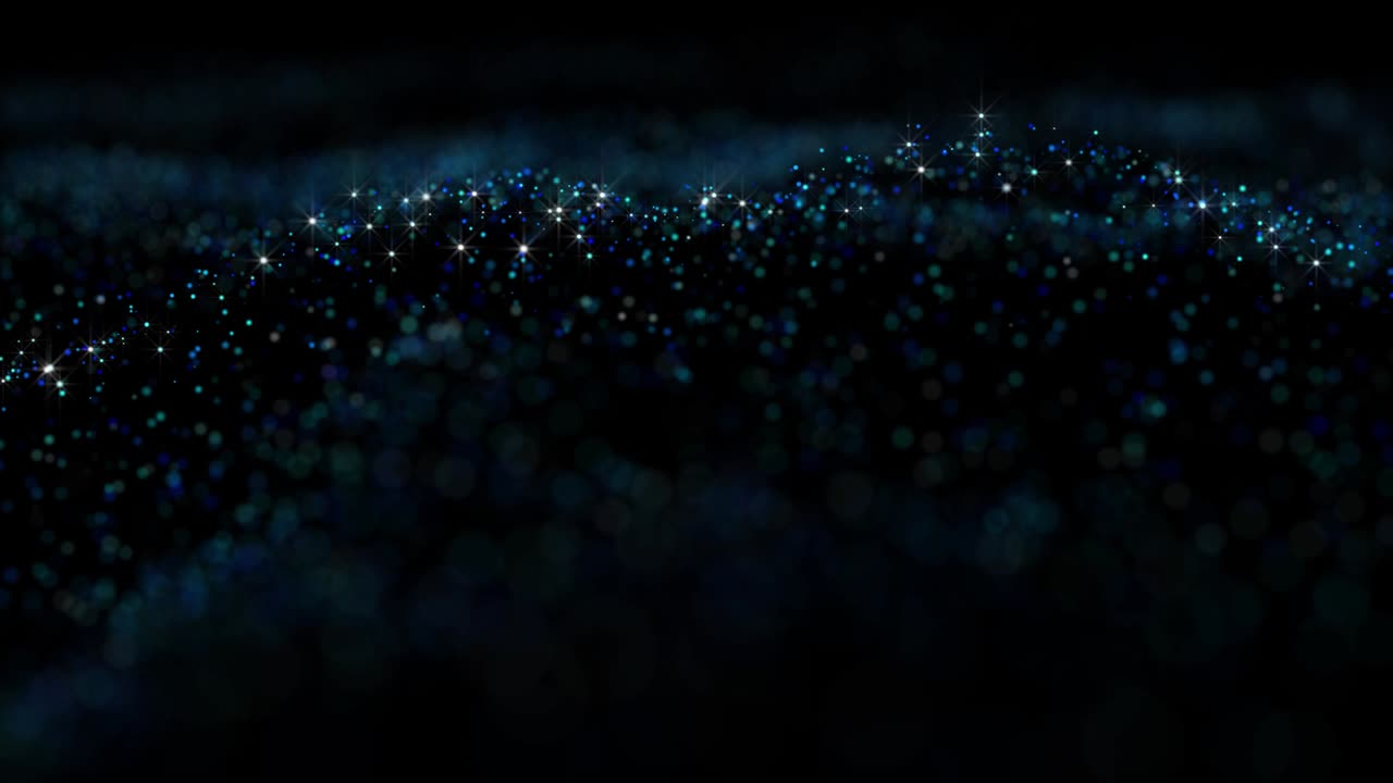 Animated background with particles with a shallow depth of focus.