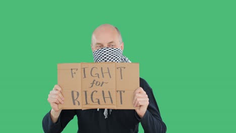 activist holding fight for right sign on green background