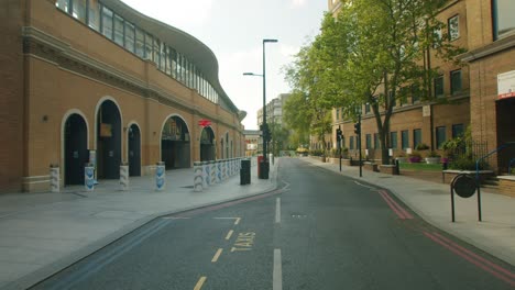 lockdown in london, deserted street entrance to london bridge train station with thank you nhs and key worker signs, during the covid-19 pandemic 2020.