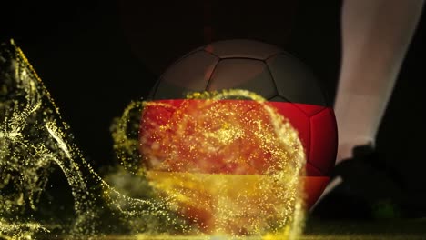 Animation-of-glitter-over-legs-of-caucasian-male-soccer-player-kicking-ball-with-flag-of-germany