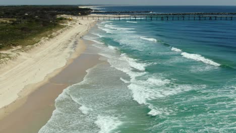 Flying-towards-the-Gold-Coast-seaway-,-Golden-beaches-and-waves-rolling-in