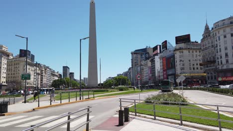 obelisk and traffic of 9 de julio, buenos aires city streets, business center of argentina pov in the morning, sunny daylight