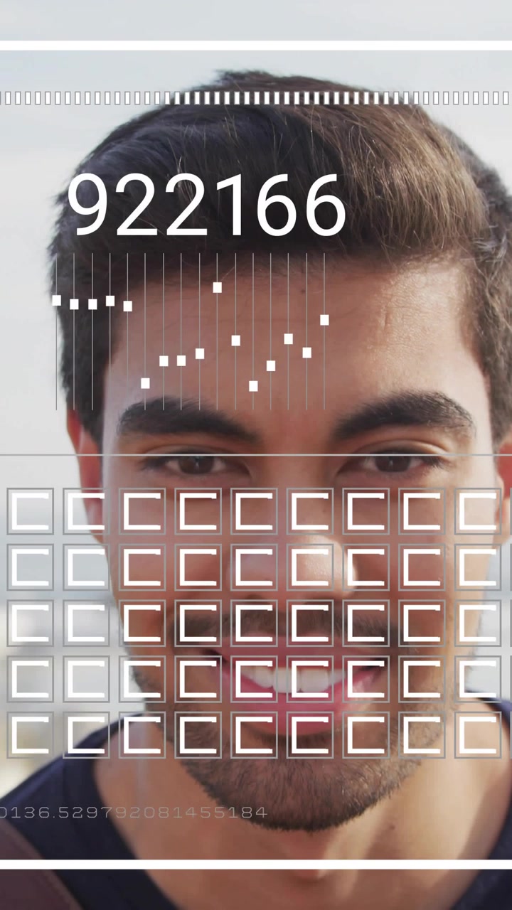 Vertical video: Man facing cam after start, overlay flashing over face, numbers cycling for tech