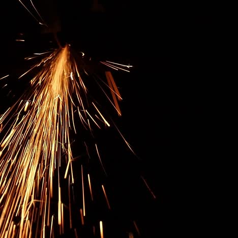 man sawing metal by grinder