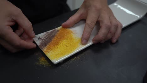 decorating plate with colorful spices powder and pattern