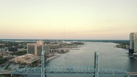 drone shot revealing the main street bridge that leads in and out of downtown jacksonville