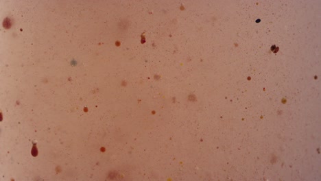 abstract bubbling falling particles in foggy liquid texture background