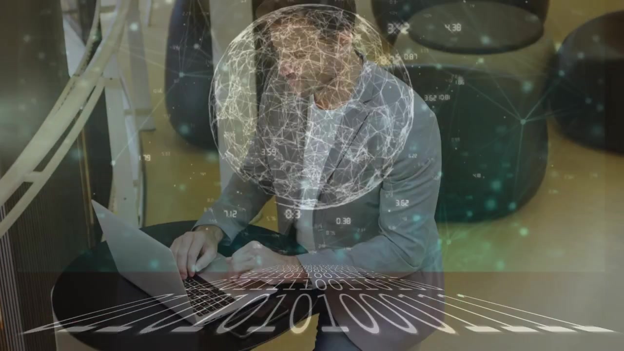 Animation of data processing and binary coding over caucasian businessman using laptop