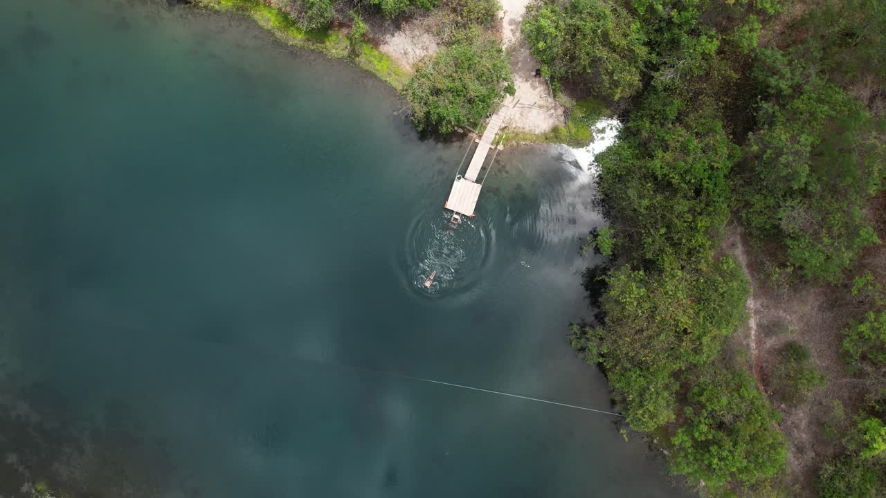 aerial view of man diving in Olhos d'&aacute;gua, Vale do Pati, Chapada Diamantina, Bahia, Brazil