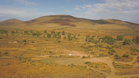 Drone-rising-up-near-Magnetic-Hill,-South-Australia