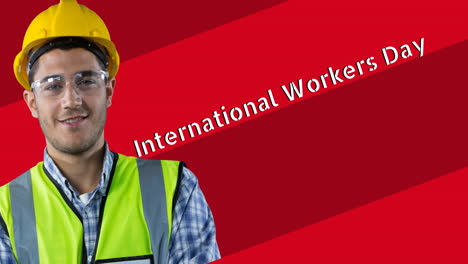 animation of smiling caucasian male worker over international workers day text