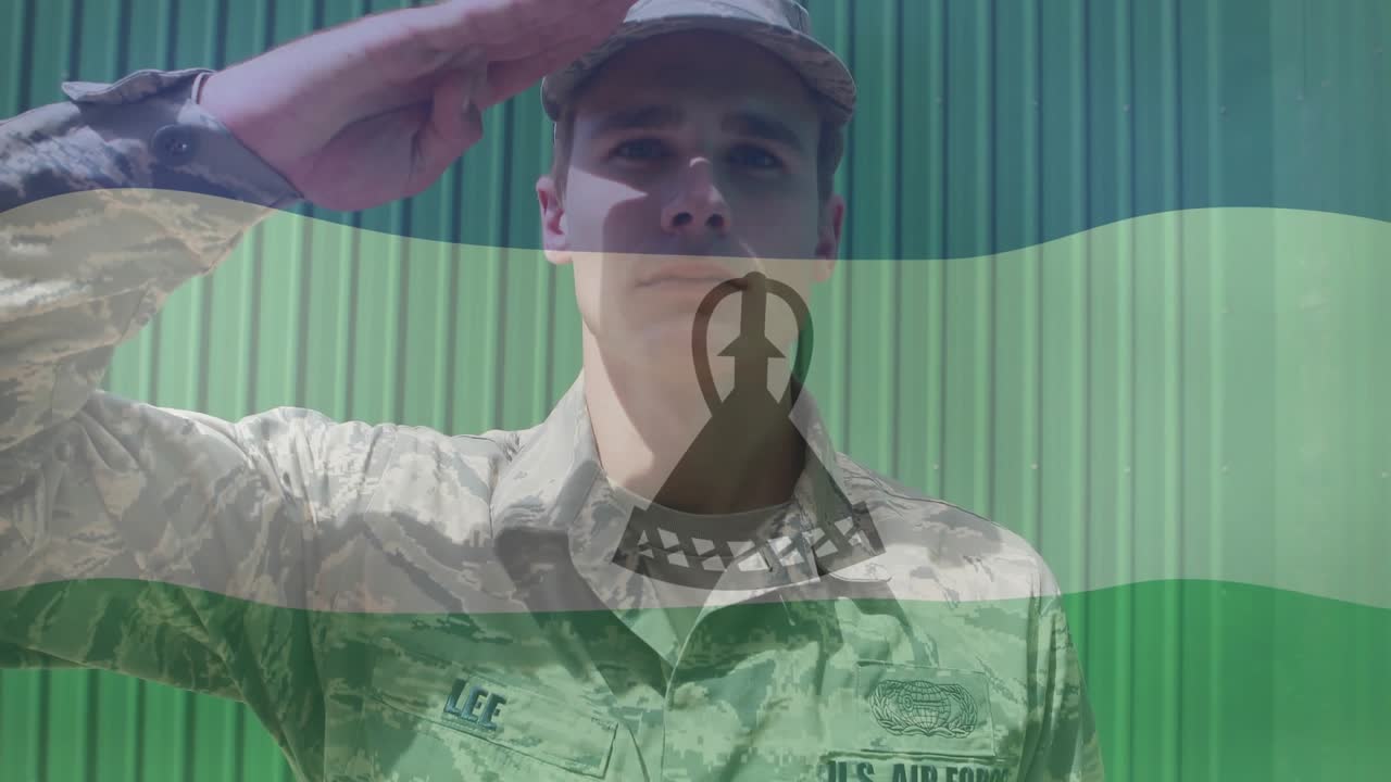 Air Force member raising right arm into salute upon flag overlay drift, honoring military service