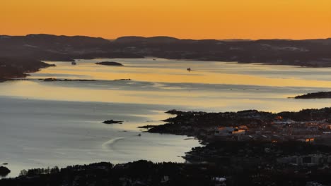 golden hour article circle sunset inlet oslofjord oslo norway norge aerial drone norwegian coastline ferries boat hovedøya hovedoya holmenkollbakken holmenkollen olympic hill parallax circle left