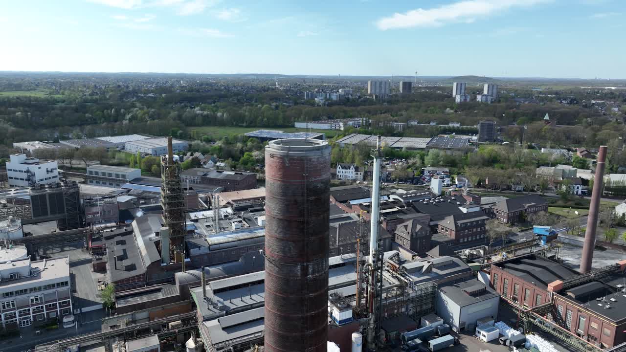 industry in the german ruhr area. Smokestacks, chimney, pipes, industrial installation. Aerial drone view.