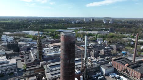 industry in the german ruhr area. smokestacks, chimney, pipes, industrial installation. aerial drone view.
