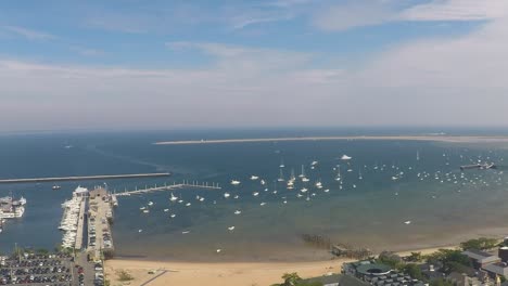 harbor view with a pier and a sandy beach