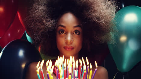 Beautiful-young-hispanic-woman-holding-cake-celebrating-birthday-pink-and-blue-balloon-background---Red-Epic-Dragon