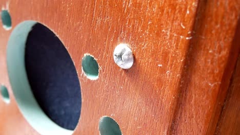 Vintage-wooden-paranormal-ghost-box-spirit-communication-speaker-holes-radio-close-up-dolly-left