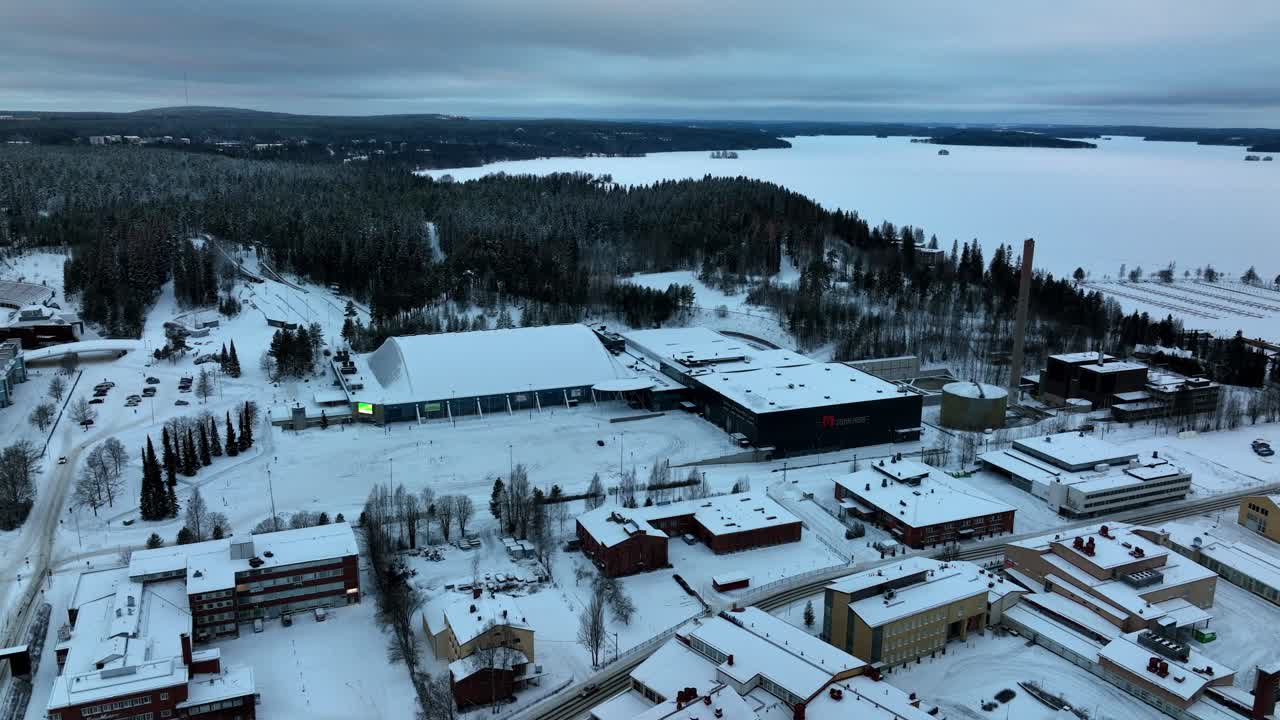 Aerial tracking shot the Grand hall and Sports and Fair Centre, winter in Lahti