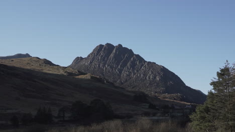 Mountains-Peaking-Over-Hill-During-Late-Afternoon