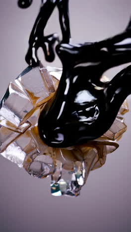 black liquid splashing and glass