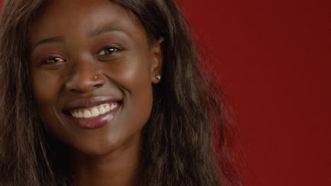 cu young woman smiles at camera