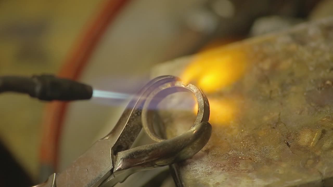Italian Goldsmith at work building an engagement or a wedding ring