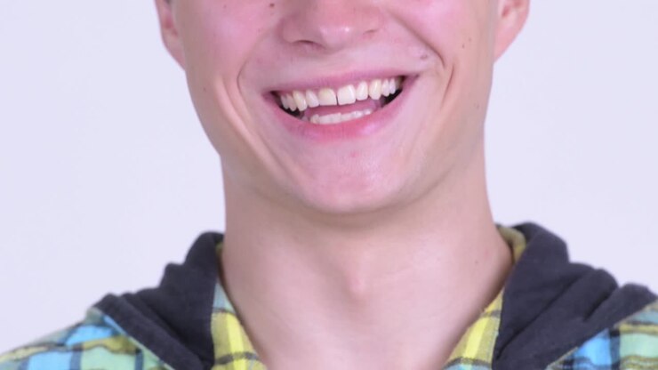 Happy young handsome hipster man