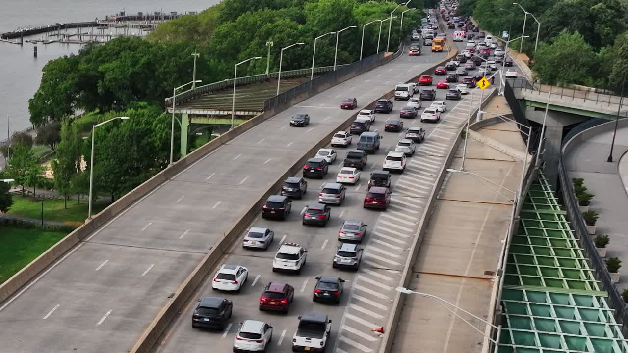 Traffic flows along a busy highway in New York City during rush hour