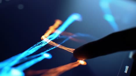 an engaging interaction with a touchscreen interface showcasing vibrant light and colorful digital patterns representing creativity and innovation