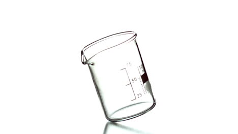 empty beaker spinning on white background