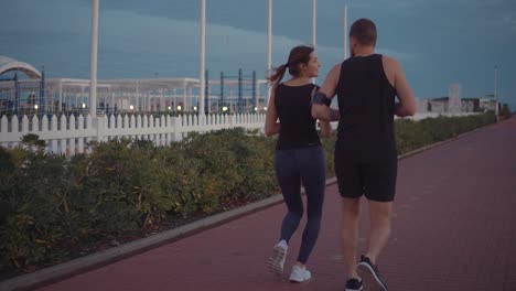 couple running outdoors at dusk