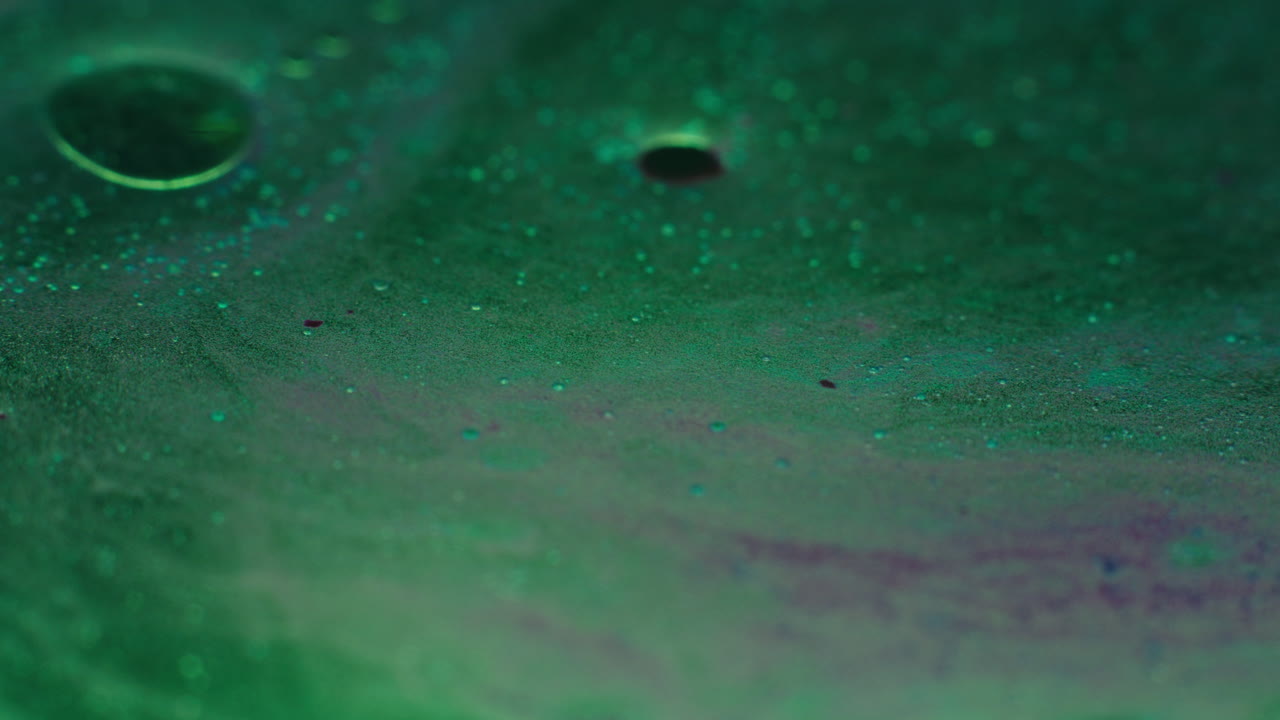 Colourful, organic, liquids macro shots buzzing and flowing