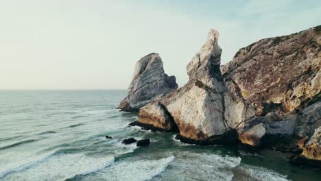 coastal cliffs and waves at sunset