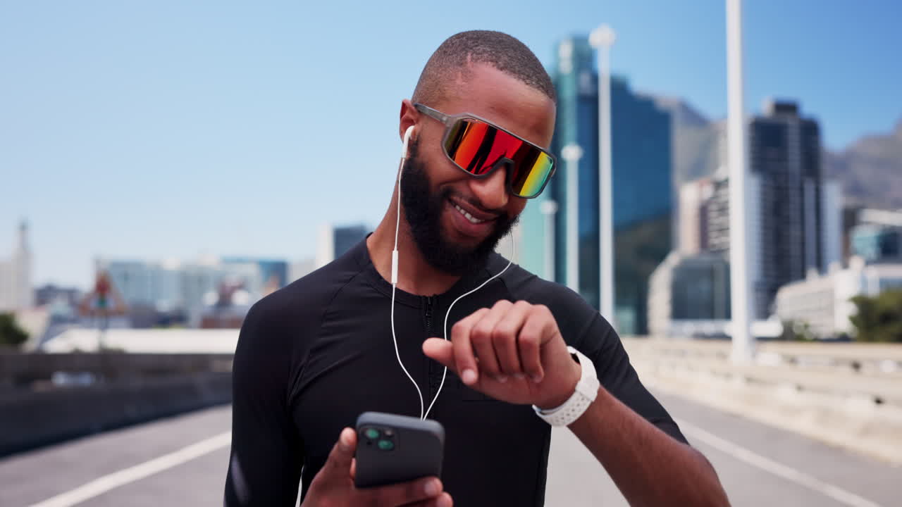Smiling Athlete Using Smartphone and Smartwatch Outdoors